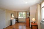 Spacious upper bedroom with A/C and fan